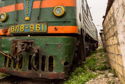 A freight train passes dangerously close.