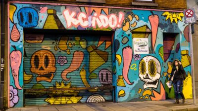 Colourfully spray painted storefront (images of skulls and carrots) on Chancery Street, Dublin, Ireland. © 2016 Nicholas Orloff