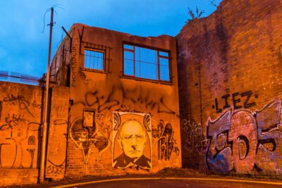 Graffiti bathed in warm streetlights in an abandoned disused dead end in Dublin, Ireland. © 2016 Nicholas Orloff